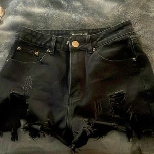 pretty little thing black ripped short ACTUAL POCKETS